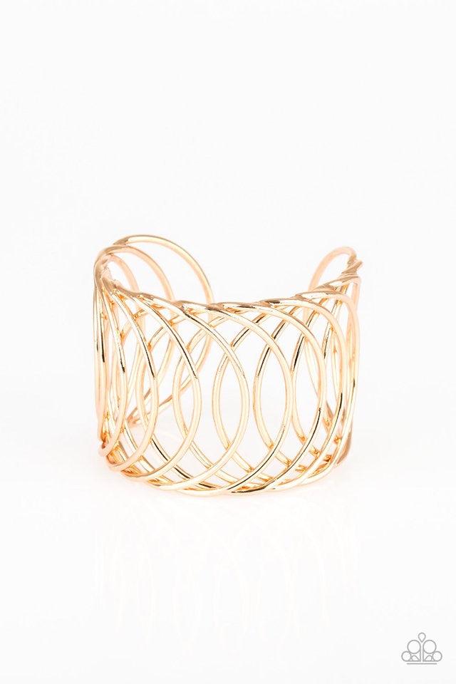 Paparazzi Accessories Dizzyingly Diva - Gold Overlapping gold circular frames coalesce into a dizzying cuff for a classic look. Jewelry