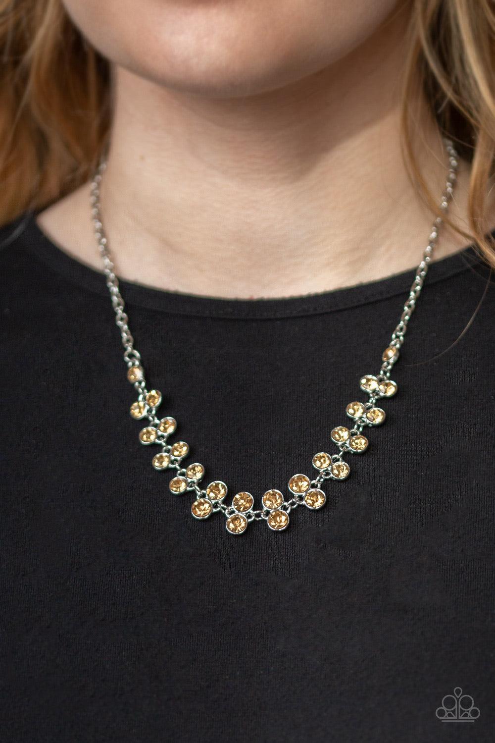 Paparazzi Accessories Super Starstruck - Brown Pairs of golden topaz rhinestones join below the collar for a timeless look. Features an adjustable clasp closure. Jewelry