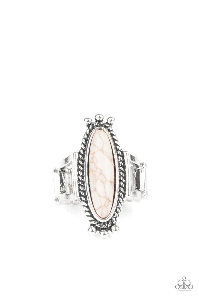 Paparazzi Accessories Sahara Escape - White An oblong white stone is pressed into the center of a rustic silver frame radiating with studded and metallic ropelike textures, creating a seasonal centerpiece atop the finger. Features a stretchy band for a fl