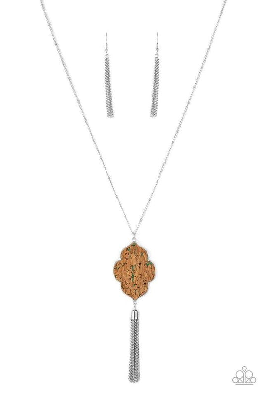 Paparazzi Accessories One Night In Casablanca - Green Flecked in glittery green sparkles, a scalloped cork frame is pressed into a sleek silver frame at the bottom of a dainty silver satellite chain. A classic silver chain tassel swings from the whimsical