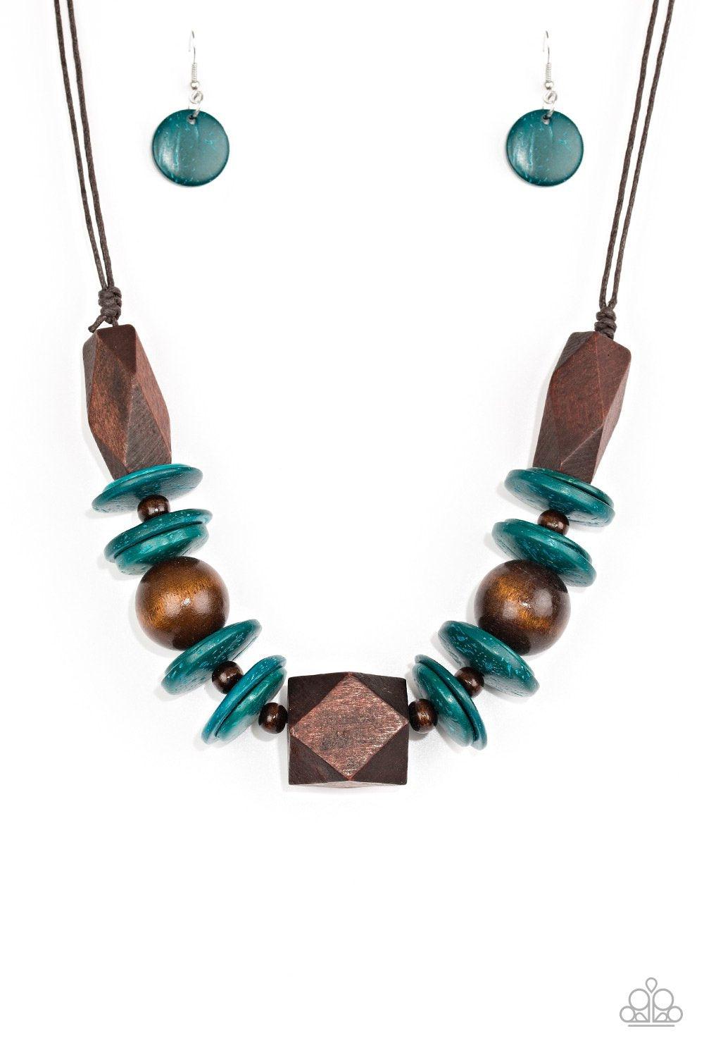 Paparazzi Accessories Pacific Paradise - Blue Featuring abstract geometric finishes, mismatched brown wooden beads and refreshing blue accents are threaded along shiny brown cording. A dramatic geometric bead adorns the center, creating a bold summery loo