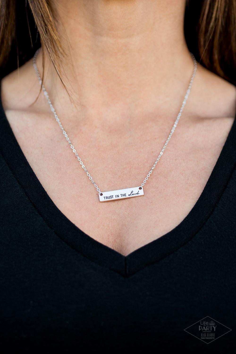 Paparazzi Accessories Trust In The Lord ~Silver Brushed in an antiqued shimmer, a rectangular silver pendant is engraved in the phrase “Trust in the Lord” for an inspirational finish. Features an adjustable clasp closure.