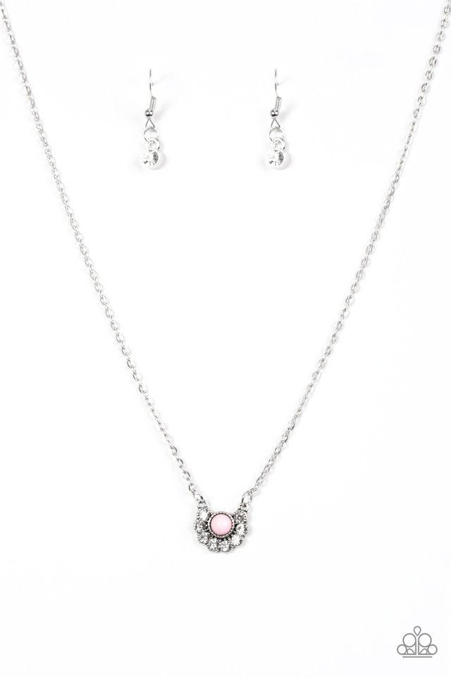 Paparazzi Accessories Pampered Princess - Pink Dainty white rhinestones are encrusted along the bottom of a dainty pink bead, creating a glamorous pendant below the collar. Features an adjustable clasp closure. Sold as one individual necklace. Includes on
