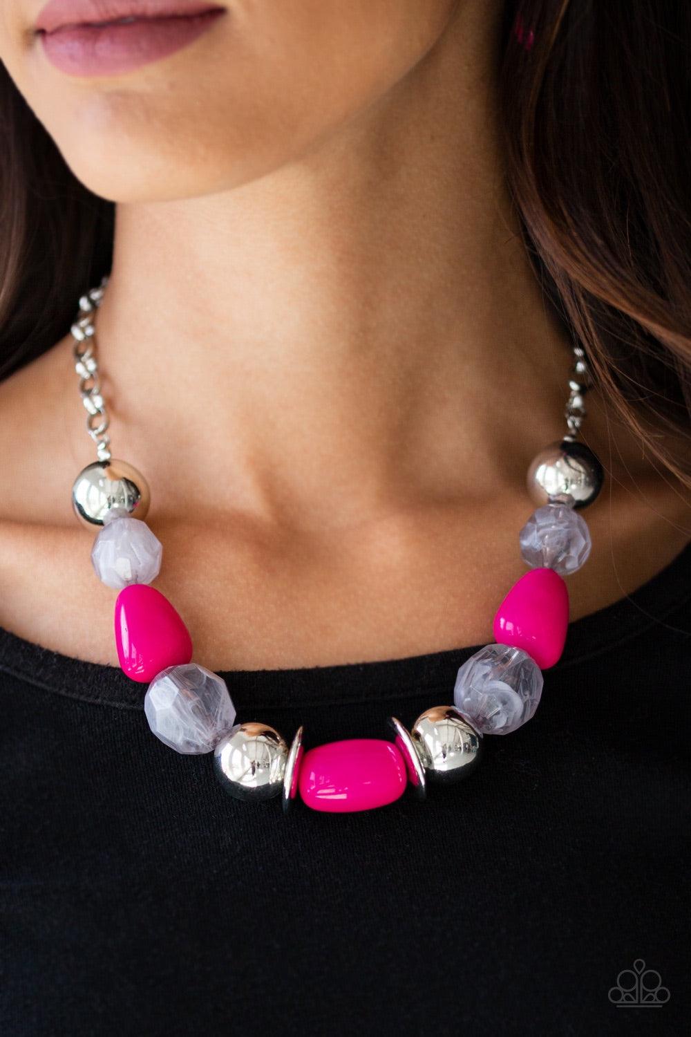 Paparazzi Accessories South Shore Sensation - Pink Dramatic silver, vibrant pink, and faceted cloudy beads are threaded along an invisible wire below the collar for a seasonal look. Features an adjustable clasp closure. Jewelry