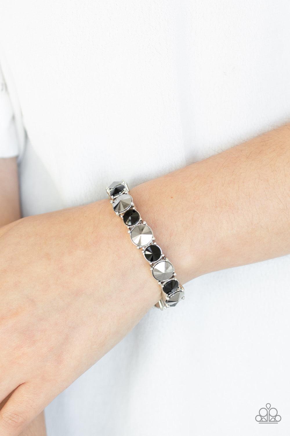 Paparazzi Accessories Born To Bedazzle - Multi An assortment of oversized black and hematite rhinestones are pressed into sleek square frames and threaded along stretchy bands, creating a blinding sparkle around the wrist. Jewelry