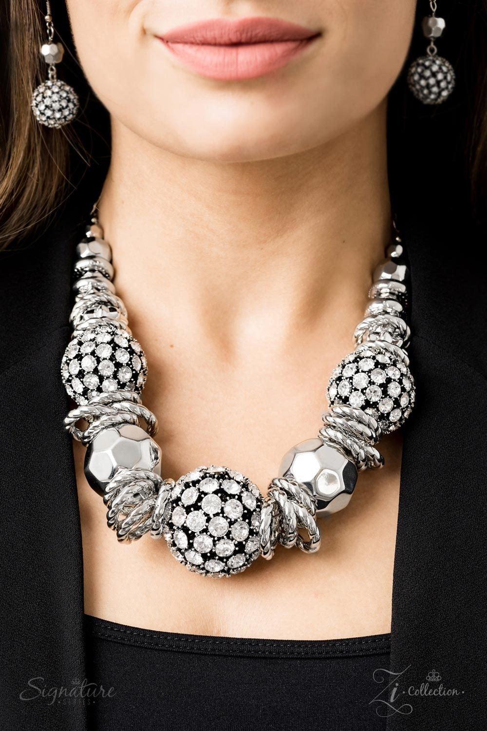 Paparazzi Accessories The Barbara 💗ZiCollection $25💗 Oversized beads encrusted in rhinestones collide with textured silver hoops and large faceted silver beads in this jaw-dropping piece. The metallic accents and shimmering spheres increase in size as t