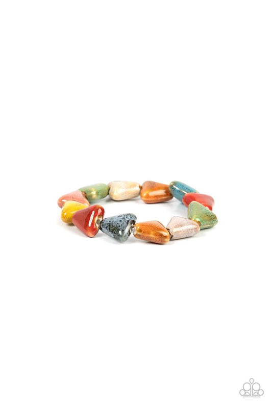 Paparazzi Accessories SHARK Out of Water - Multi Our SHARK Out of Water statement piece is a must-have for any spring/summer wardrobe! Painted in distressed multicolored finishes, ceramic beads shaped like shark teeth are threaded along a stretchy band ar
