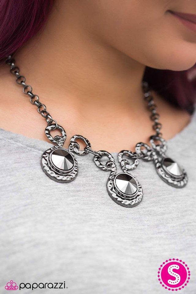 Paparazzi Accessories Hypnotize - Black Three dramatically oversized pieces of hematite are nestled into three textured gunmetal fittings that are connected by oval gunmetal rings, creating a brilliant statement piece. Features an adjustable clasp closure