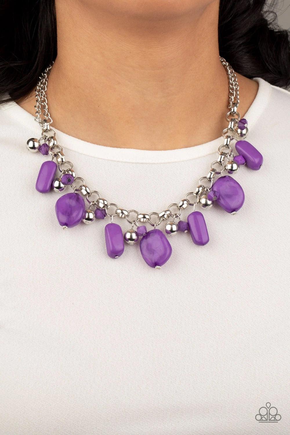 Paparazzi Accessories Grand Canyon - Purple Featuring polished and cloudy finishes, a collection of purple faux rocks dance from the bottom of a bold silver chain. Classic silver beads trickle between the colorful beading, adding a metallic shimmer to the