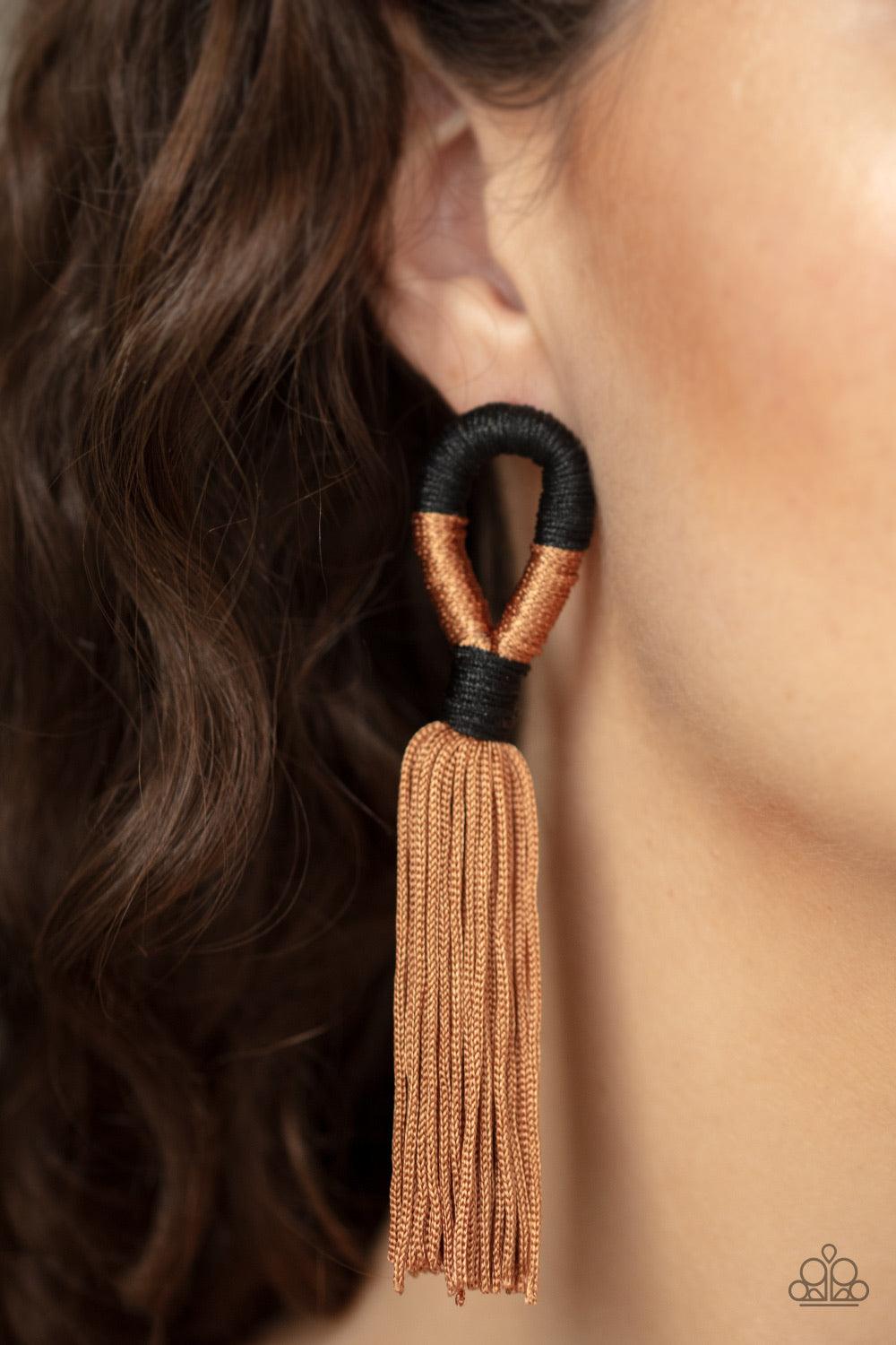 Paparazzi Accessories Moroccan Mambo - Brown Shiny black and Lark cording knots around a round fitting as a plume of soft Lark cording free-falls from the bottom, creating a trendy tassel. Earring attaches to a standard post fitting. Jewelry