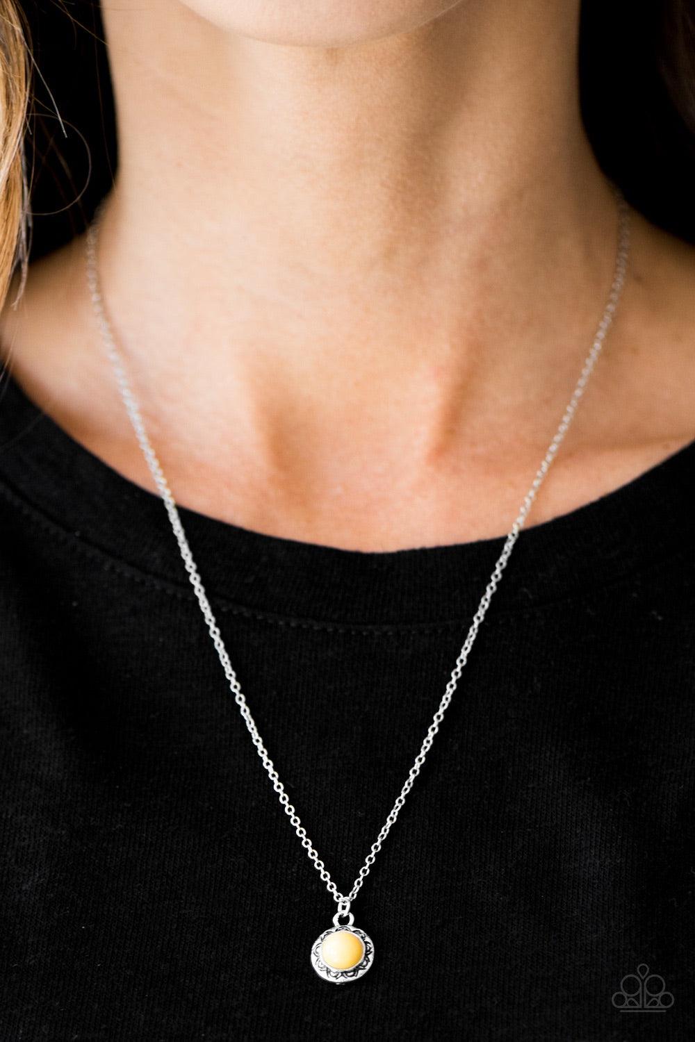 Paparazzi Accessories Wildflower Walt - Yellow A polished yellow bead is pressed into the center of a silver frame etched in floral details. Brushed in an antiqued shimmer, the dainty pendant swings below the collar in a whimsical fashion. Features an adj