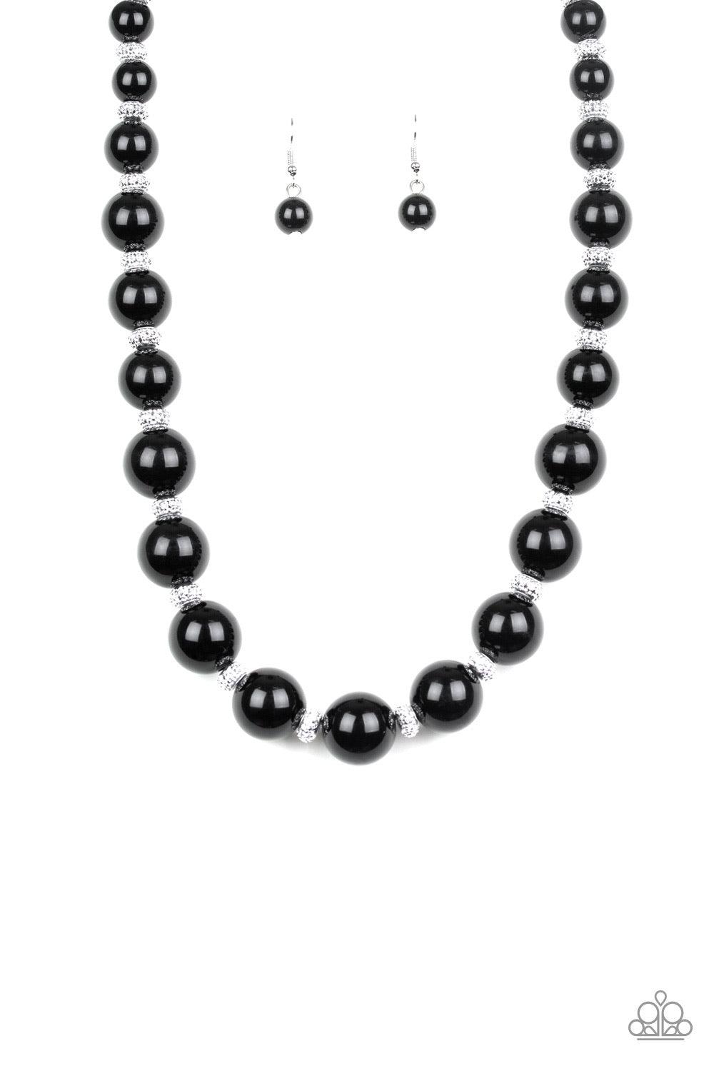 Paparazzi Accessories Uptown Heiress - Black Infused with dainty silvery rhinestone encrusted beads, a refined collection of oversized black beads are threaded along an invisible wire below the collar for a timeless dazzle. Features an adjustable clasp cl