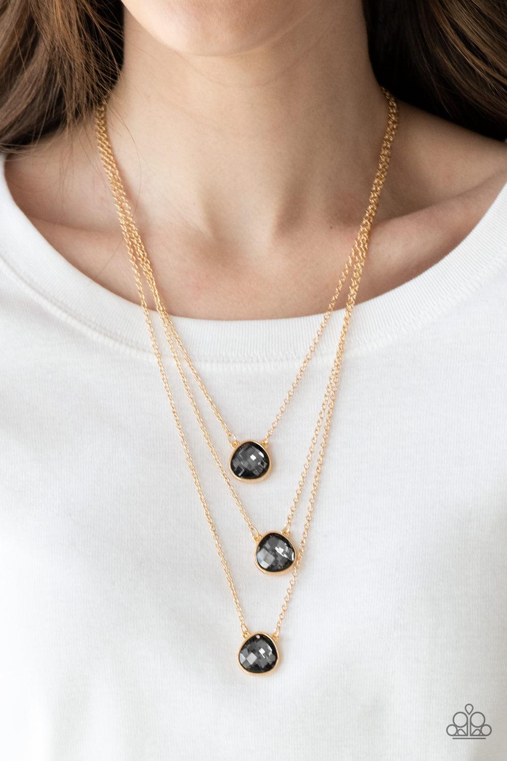 Paparazzi Accessories Once in a MILLIONAIRE - Multi Featuring sleek gold frames, imperfect teardrop gems layer down the chest in a refined fashion. Features an adjustable clasp closure. Sold as one individual necklace. Includes one pair of matching earrin