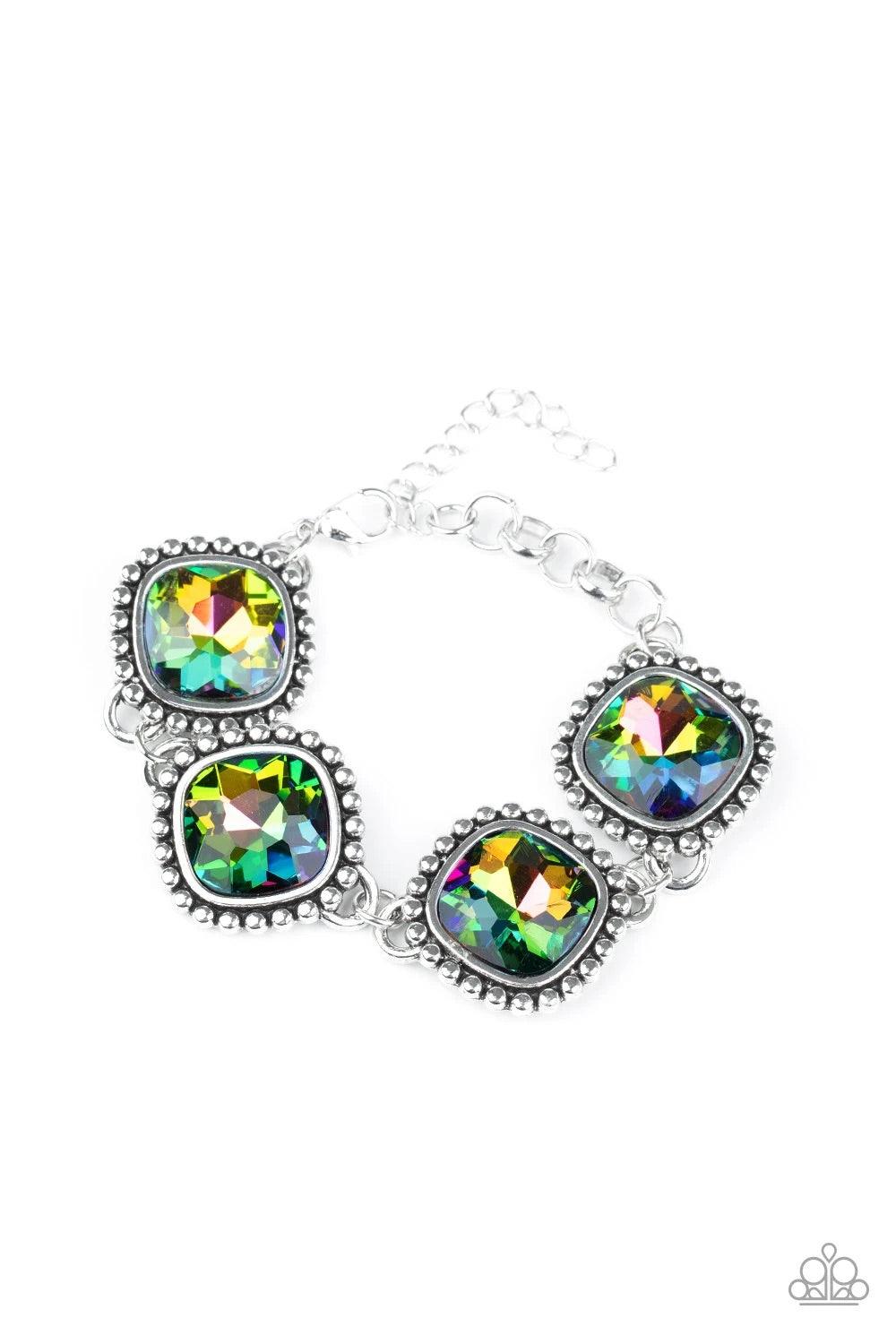 Paparazzi Accessories Megawatt - Multi Featuring dramatically studded silver frames, an exaggerated display of oversized oil spill rhinestone encrusted frames delicately link around the wrist for a blinding look. Features an adjustable clasp closure. Sold