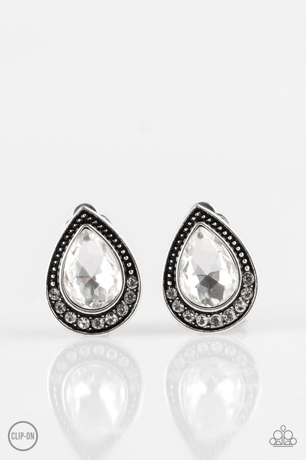 Paparazzi Accessories Radiantly Ravishing - White *Clip-On A glassy white gem is pressed into an ornate silver teardrop. Infused with dainty silver studs, the bottom of the frame is encrusted in glittery white rhinestones for a classic finish. Earring att