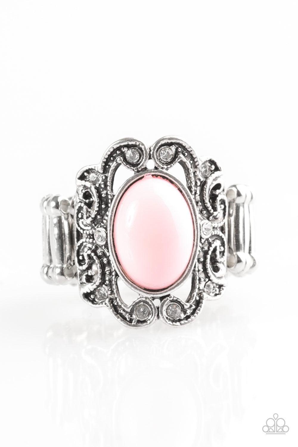 Paparazzi Accessories Pasadena Princess - Pink A pink bead is pressed into the center of a regal silver frame. Dazzling white rhinestones are sprinkled along fancy silver filigree, creating a stunning band. Features a stretchy band for a flexible fit. Jew