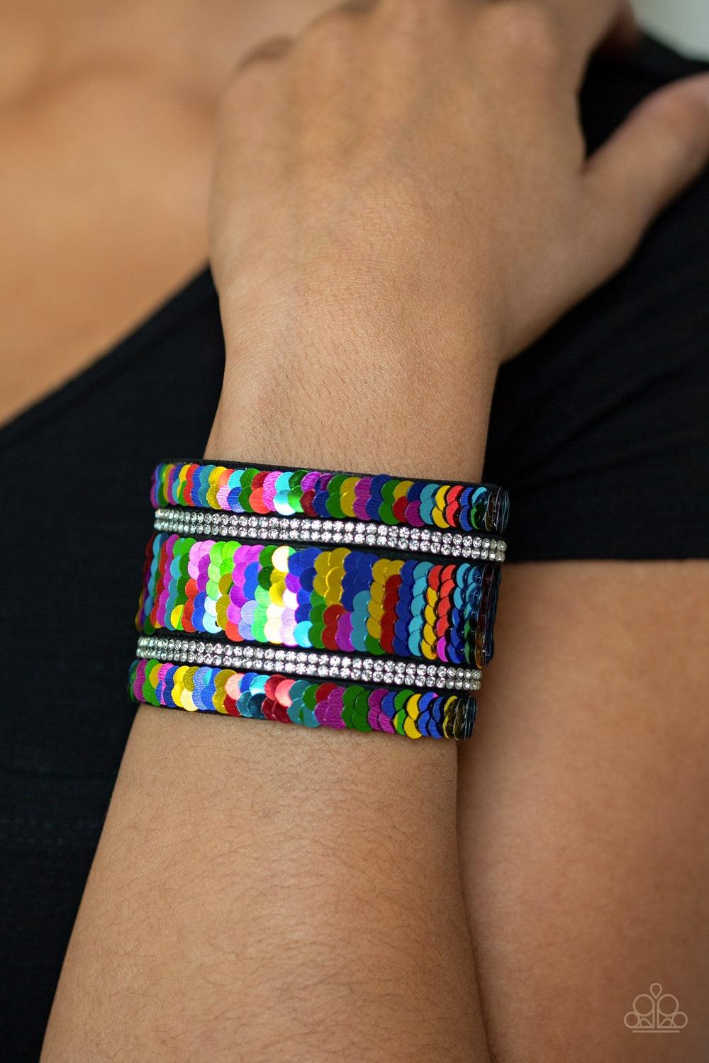 Paparazzi Accessories MERMAID Service - Multi Infused with strands of blinding white rhinestones, row after row of shimmery sequins are stitched across the front of a spliced black suede band. Bracelet features reversible sequins that change from silver t