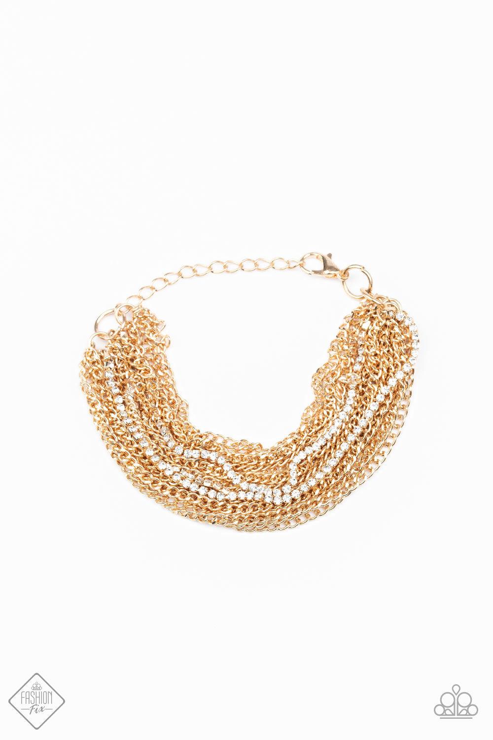 Paparazzi Accessories Pour Me Another - Gold Infused with sporadic strands of glittery white rhinestones, countless shiny gold chains layer around the wrist to create a dramatic shimmer. Features an adjustable clasp closure. Jewelry