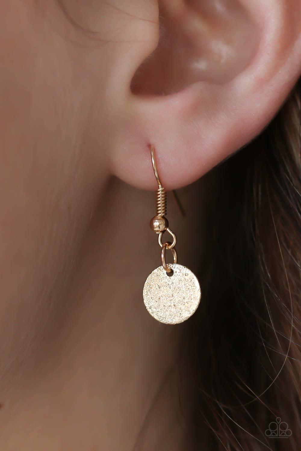 Paparazzi Accessories Bohemian Bombshell - Gold Delicately hammered in glistening textures, glittery gold discs swing from the bottom of a bowing gold bar for a flirty, bohemian look. Features an adjustable clasp closure. Jewelry