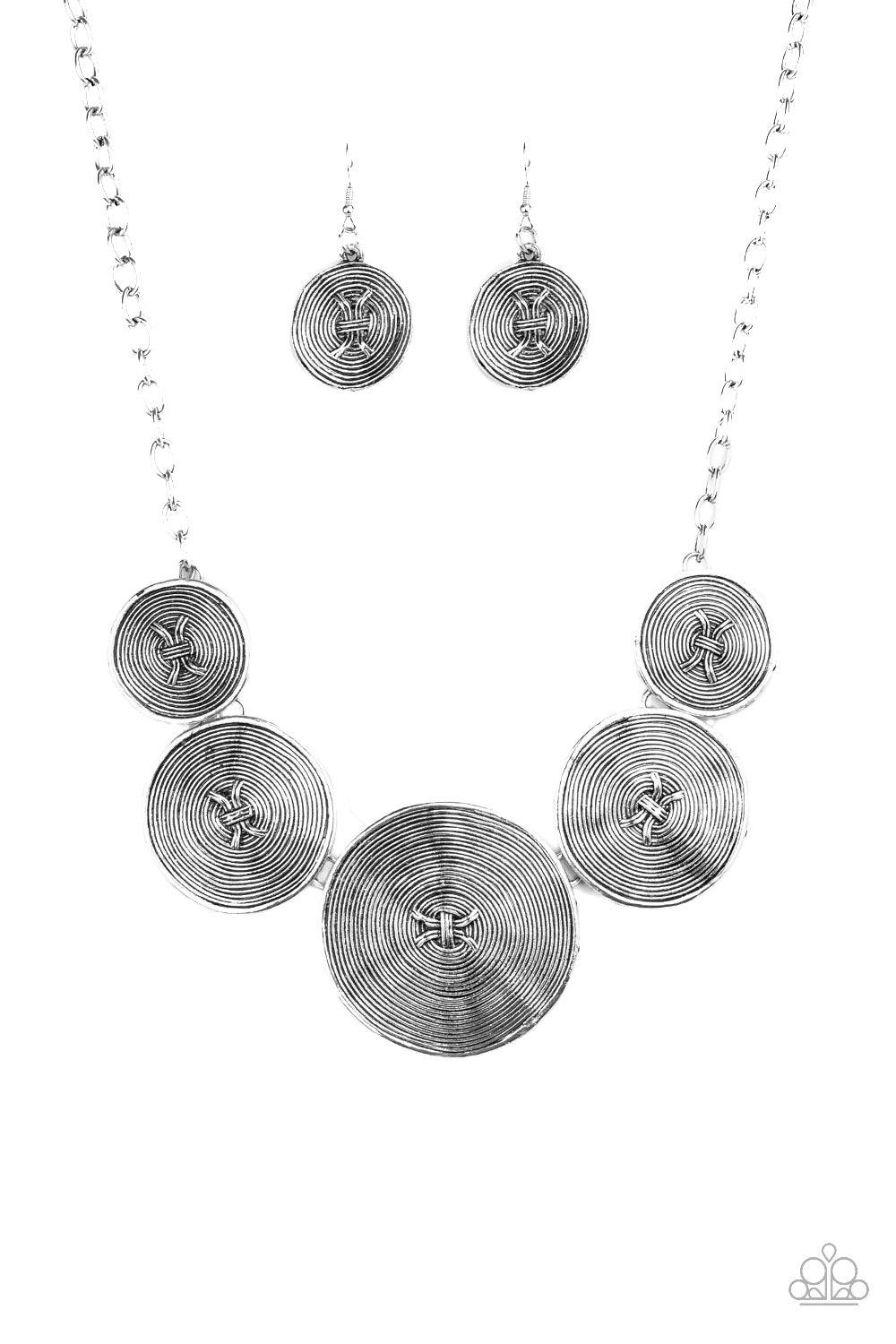 Paparazzi Accessories Deserves A Medal - Silver Radiating with spiraling textures, antiqued silver discs gradually increase in size as they link below the collar for a statement making look. Features an adjustable clasp closure. Jewelry