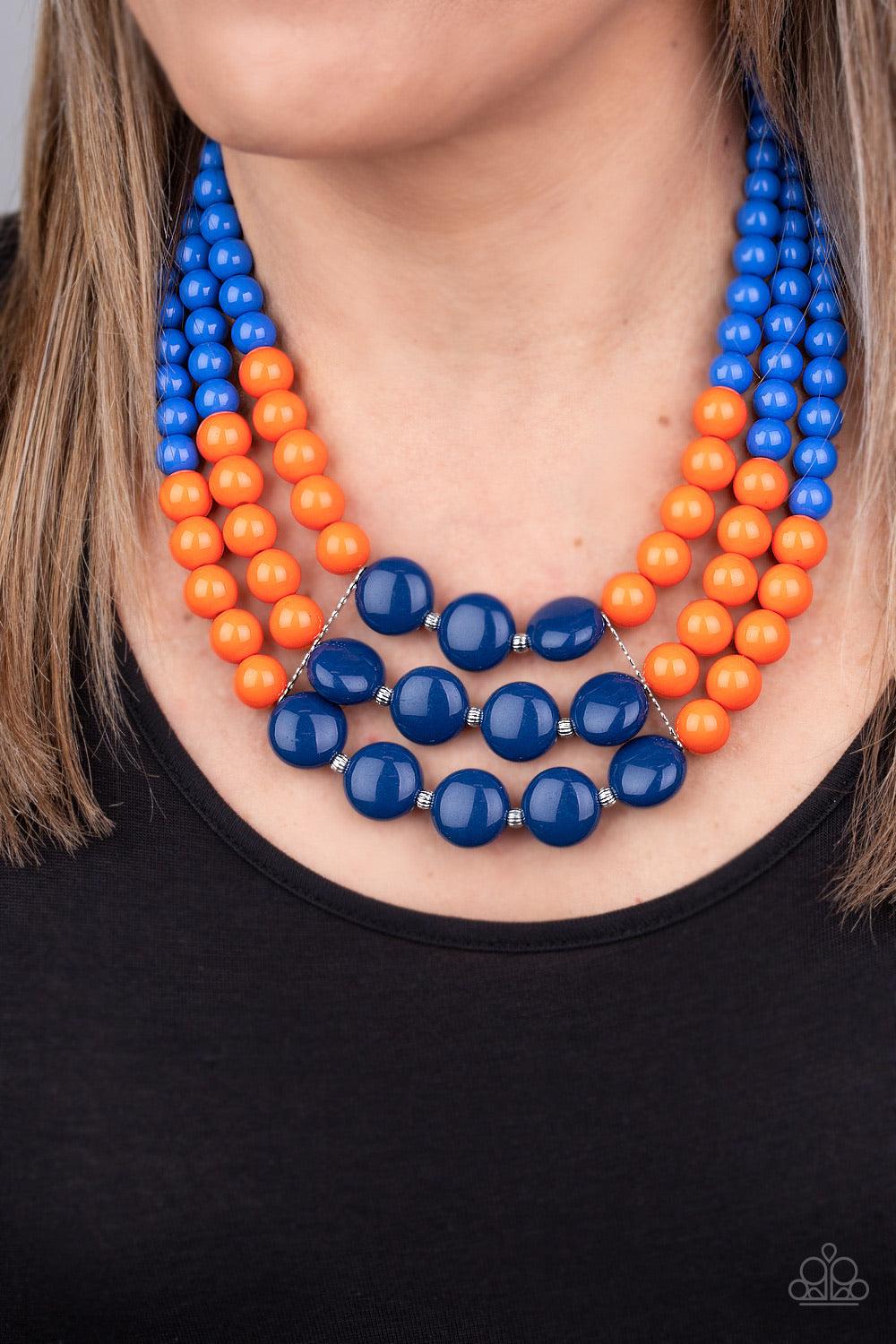 Paparazzi Accessories Beach Bauble - Blue Held together by dainty silver fittings, strands of beads fade from blue to orange to navy blue along invisible wires below the collar for a statement-making finish. Features an adjustable clasp closure. Sold as o