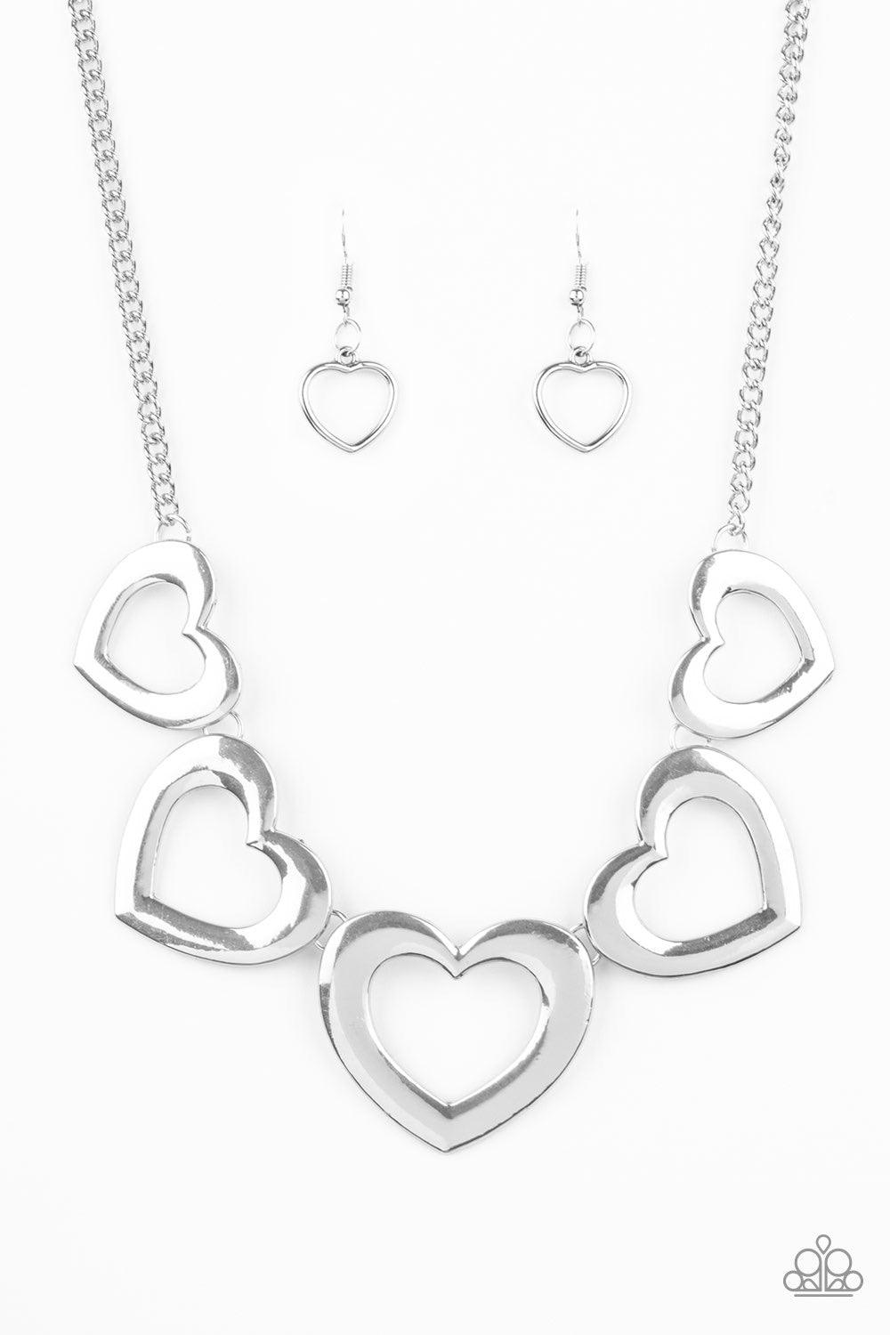 Paparazzi Accessories Hearty Hearts ~Silver Gradually increasing in size, glistening silver heart silhouettes delicately link below the collar in a charming fashion. Features an adjustable clasp closure.