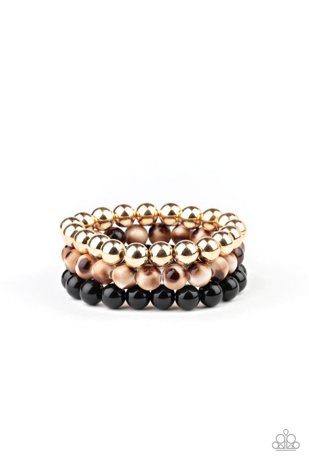 Paparazzi Accessories Courageously Couture - Black Strands of black, gold, and brown tortoise-like beads are threaded along stretchy bands around the wrist, creating colorful layers. Jewelry