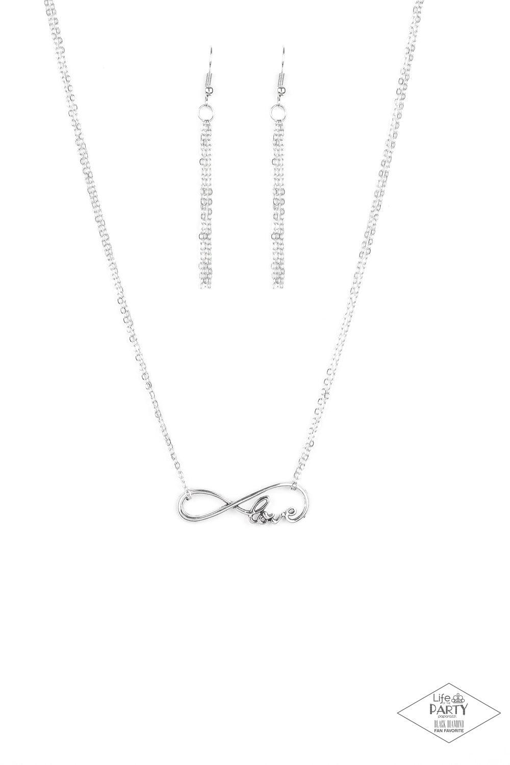 Paparazzi Accessories We Found Love ~White A dainty silver infinity charm swoops below the collar, spelling out the word “Love” in its bottom corner. Dainty silver chains loop around the airy charm, completing the delicate design. Features an adjustable c