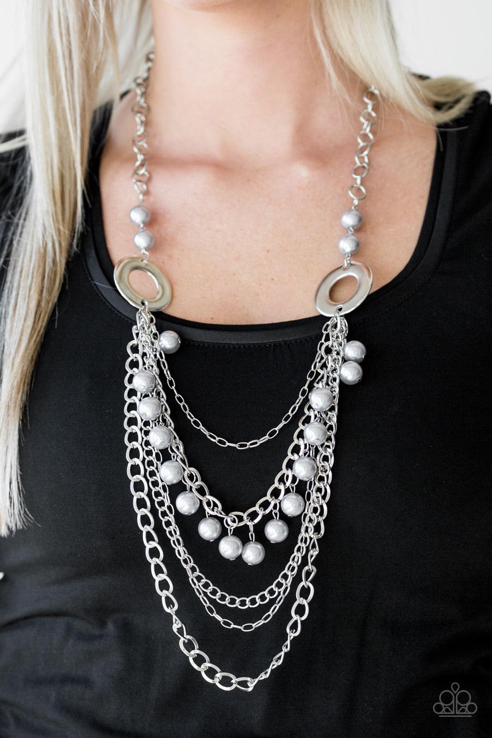 Paparazzi Accessories BELLES and Whistles - Silver Dramatic silver hoops give way to layers of mismatched silver chains. Pearly silver beads trickle from the second chain, creating a flirty fringe across the chest. Features an adjustable clasp closure. So