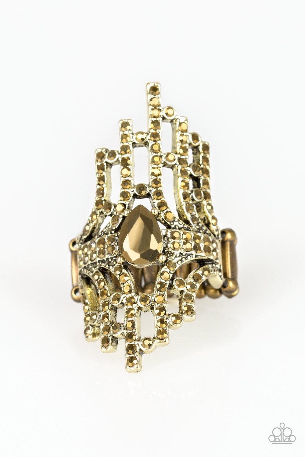 Paparazzi Accessories Modern Muse - Brass Encrusted with glittery aurum rhinestones, a collection of brass bars radiate from a teardrop aurum rhinestone center for an edgy stacked look. Features a stretchy band for a flexible fit. Jewelry
