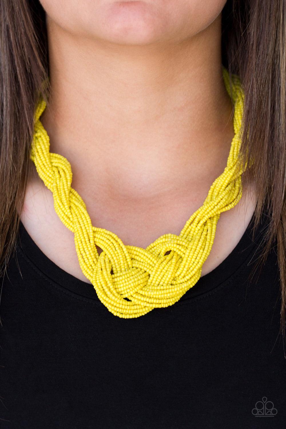 Paparazzi Accessories A Standing Ovation - Yellow Countless strands of sunny yellow seed beads are twisted and knotted together to create an unforgettable statement piece. Features an adjustable clasp closure. Jewelry