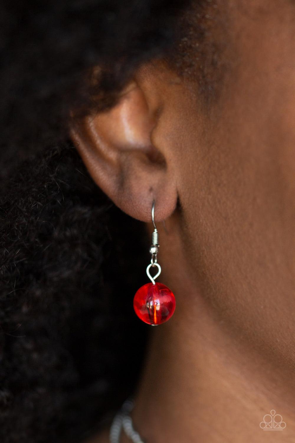 Paparazzi Accessories Beach Glam - Red Varying in shape and opacity, a refreshing collection of glassy and iridescent red beads layer below the collar for a boldly colorful look. Features an adjustable clasp closure. Sold as one individual necklace. Inclu