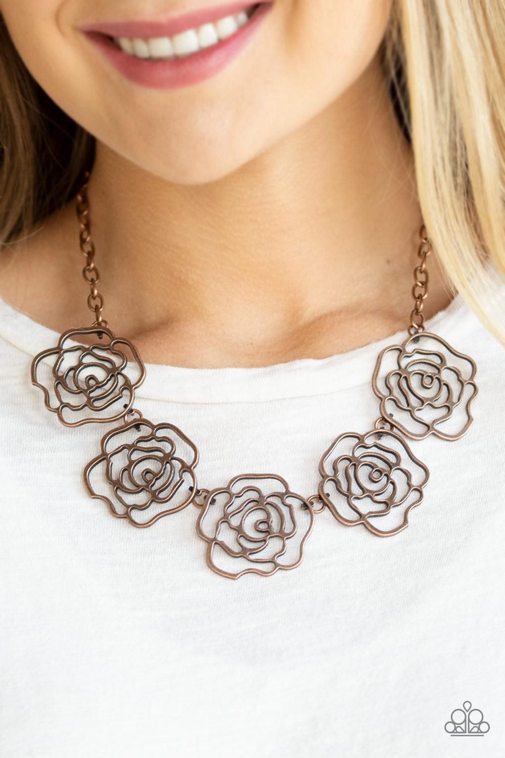 Paparazzi Accessories Budding Beauty - Copper Brushed in an antiqued finish, stenciled copper rosebuds link below the collar for a seasonal fashion. Features an adjustable clasp closure. Sold as one individual necklace. Includes one pair of matching earri