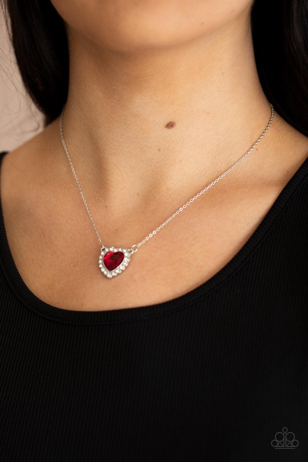 Paparazzi Accessories Out of the GLITTERY-ness of Your Heart - Red Glittery white rhinestones encircle a red heart shaped gem, creating a flirty pendant below the collar. Features an adjustable clasp closure. Sold as one individual necklace. Includes one