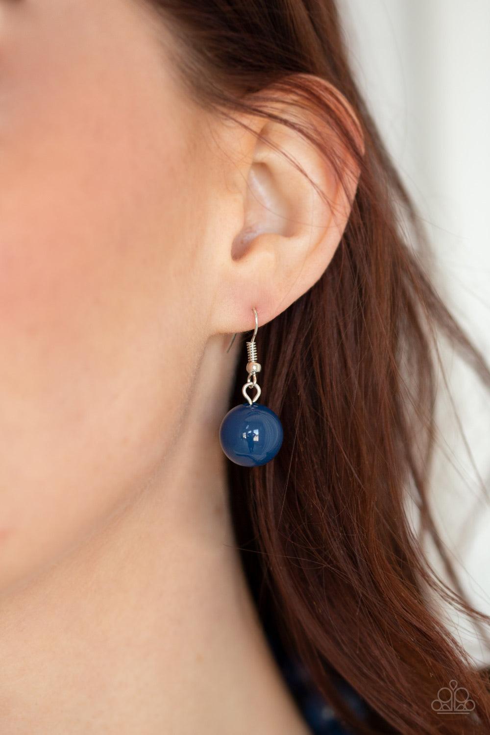 Paparazzi Accessories Poppin Popularity - Blue Infused with dainty Evening Blue beads, round Evening Blue beads trickle into bold oval beads, creating a bold pop of color below the collar. Features an adjustable clasp closure. Jewelry