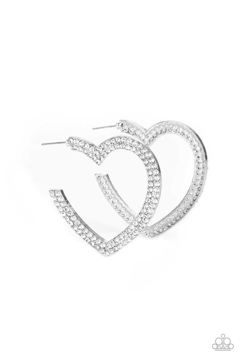 Paparazzi Accessories Amore To Love - White Two rows of blinding white rhinestones are encrusted along the front of a heart shaped silver hoop, creating a heart-stopping sparkle. Hoop measures approximately 2" in diameter. Earring attaches to a standard p