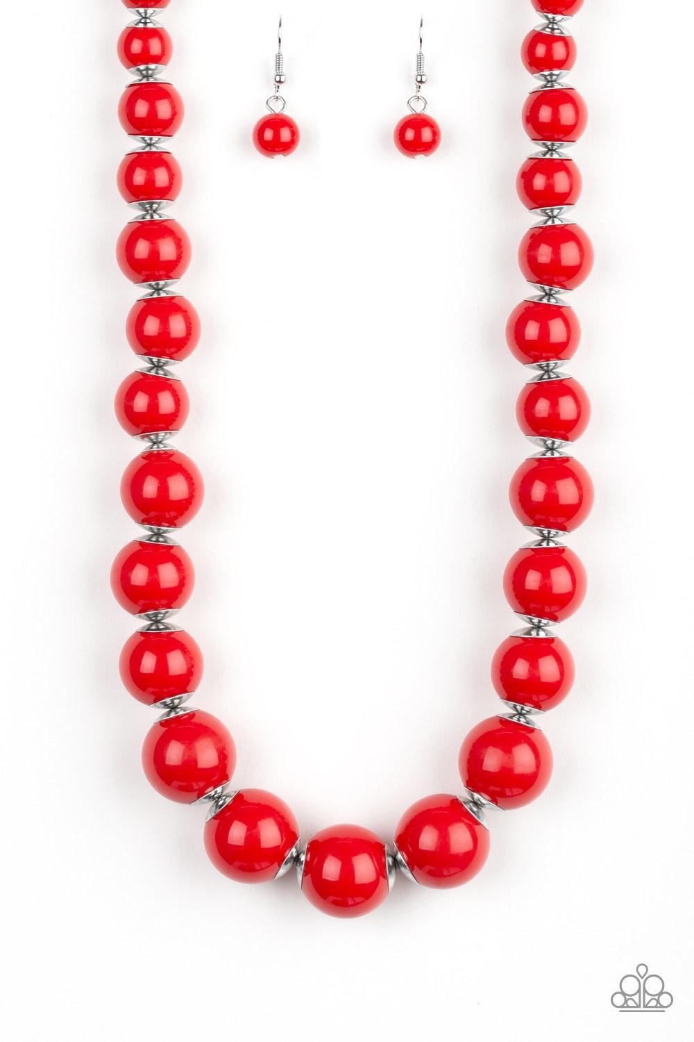 Paparazzi Accessories Everyday Eye Candy - Red Infused with metallic accents, fiery red beads gradually increase in size as they are threaded along an invisible wire below the collar for a vibrant pop of color. Features an adjustable clasp closure. Jewelr
