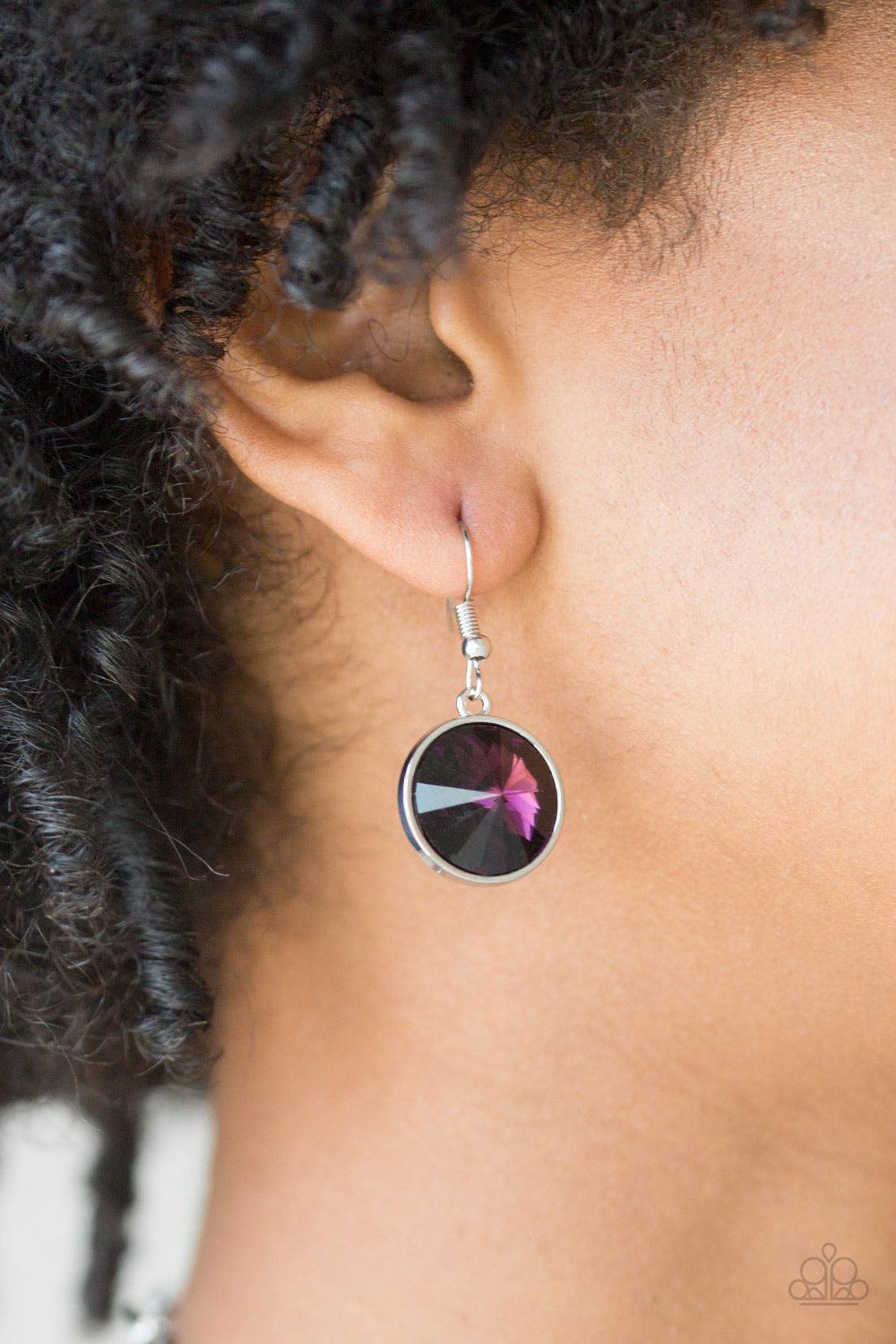 Paparazzi Accessories She Sparkles On - Purple A dramatic purple gem swings from the bottom of a shiny silver chain, creating a blinding pendant below the collar. Features a toggle closure. Jewelry