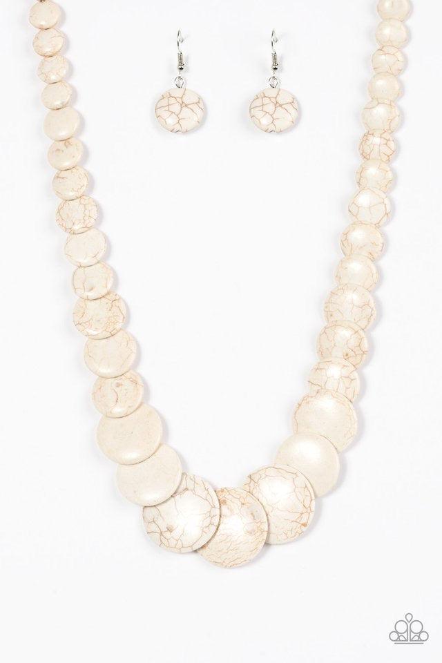 Paparazzi Accessories Sierra Mountains - White Gradually increasing in size, flat white stones are threaded along a white thread, stacking below the collar for a refreshing artisanal look. Features an adjustable clasp closure. Sold as one individual neckl