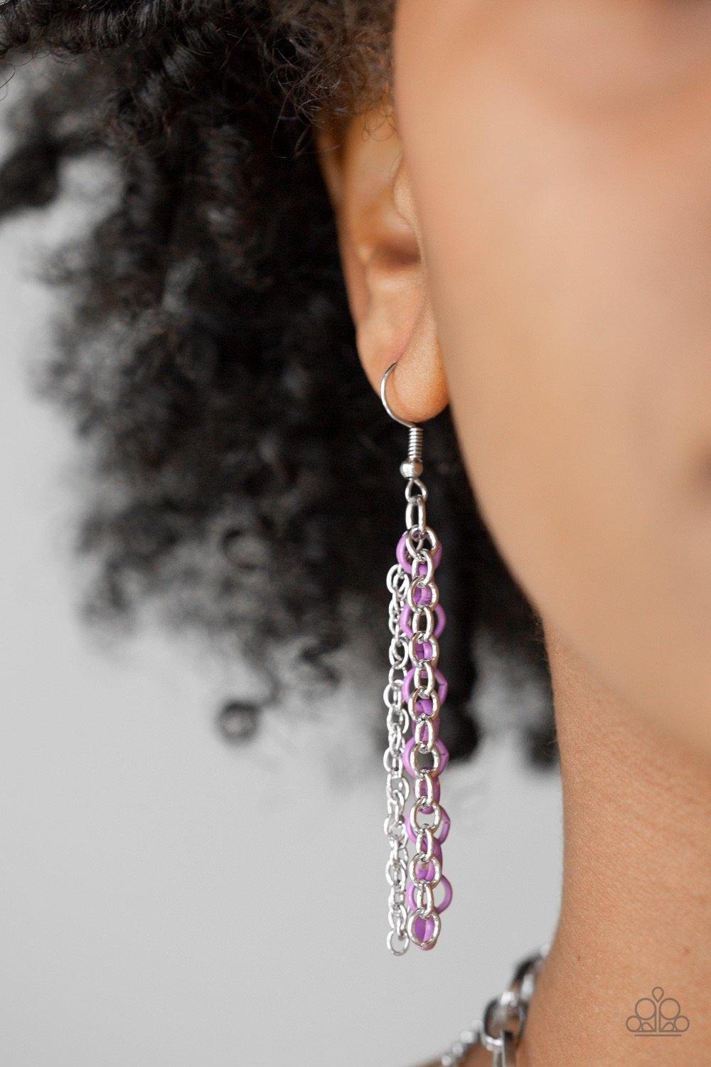 Paparazzi Accessories Color Bomb - Purple Mismatched silver chains layer below the collar for a bold industrial look. Painted in a colorful finish, a shiny purple chain drapes between the shimmery silver chains for a vivacious finish. Features an adjustab