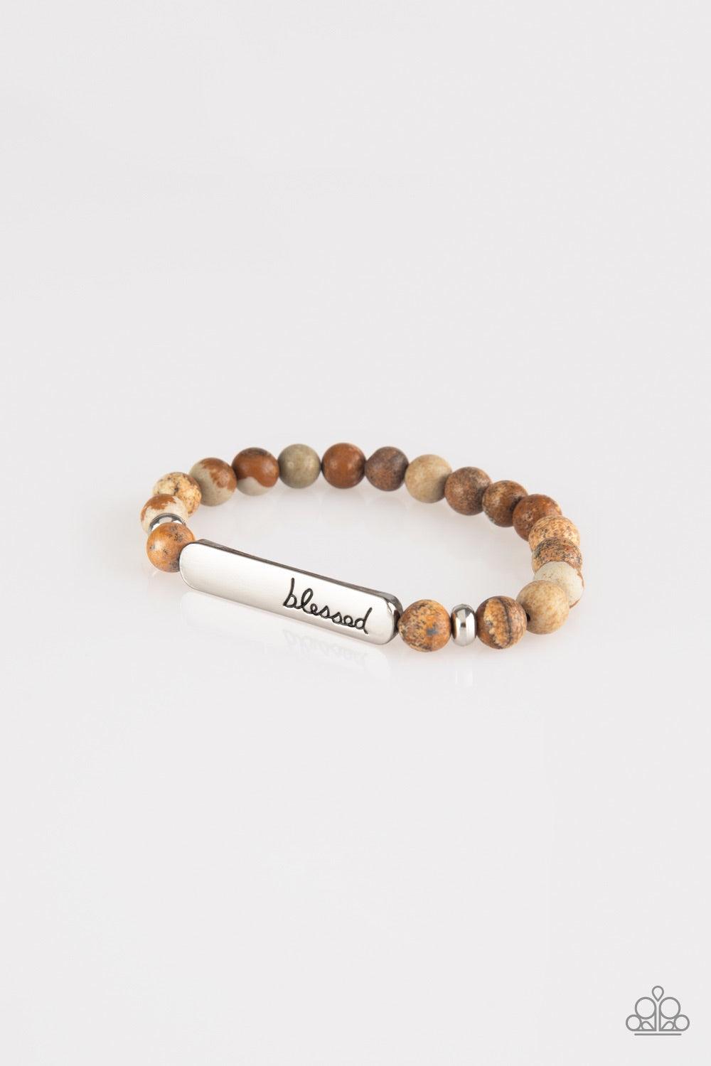 Paparazzi Accessories Born Blessed - Brown Infused with dainty silver accents, a collection of colorful natural stones are threaded along a stretchy band. A glistening silver frame engraved with the word, "blessed" adorns the center for a seasonal finish.