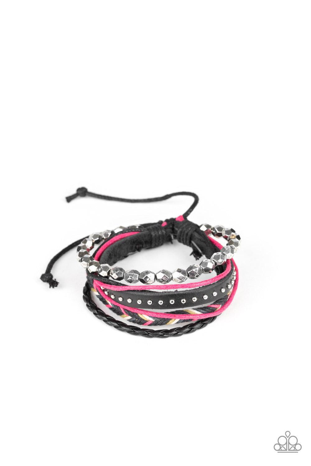 Paparazzi Accessories Wonderfully Wayfarer ~Pink Mismatched strands of silver beads, studded leather, braided leather, and pink and black cording layer around the wrist for a free-spirited style. Features an adjustable sliding knot closure. Sold as one in