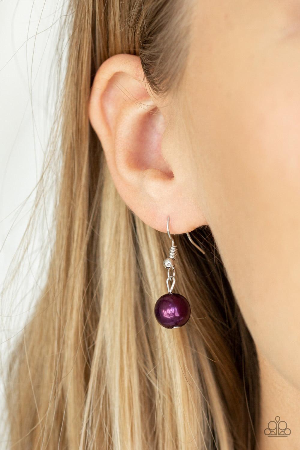 Paparazzi Accessories Rockin Rockette - Purple Varying in size, purple pearls, purple crystal-like beads, and faceted silver beads join with mismatched silver chains below the collar, creating a radically refined fringe. Features an adjustable clasp closu