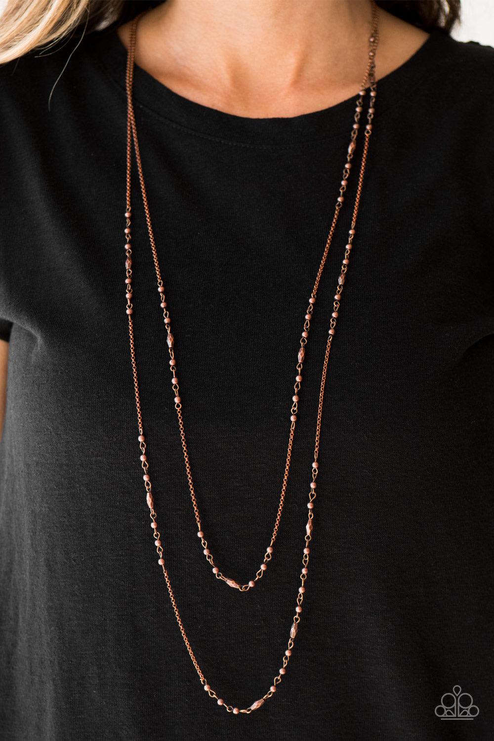 Paparazzi Accessories Rustic Allure - Copper Dainty copper beads and faceted copper accents trickle along two strands of glistening copper chain, creating a rustic tone on tone palette. Features an adjustable clasp closure. Sold as one individual necklace