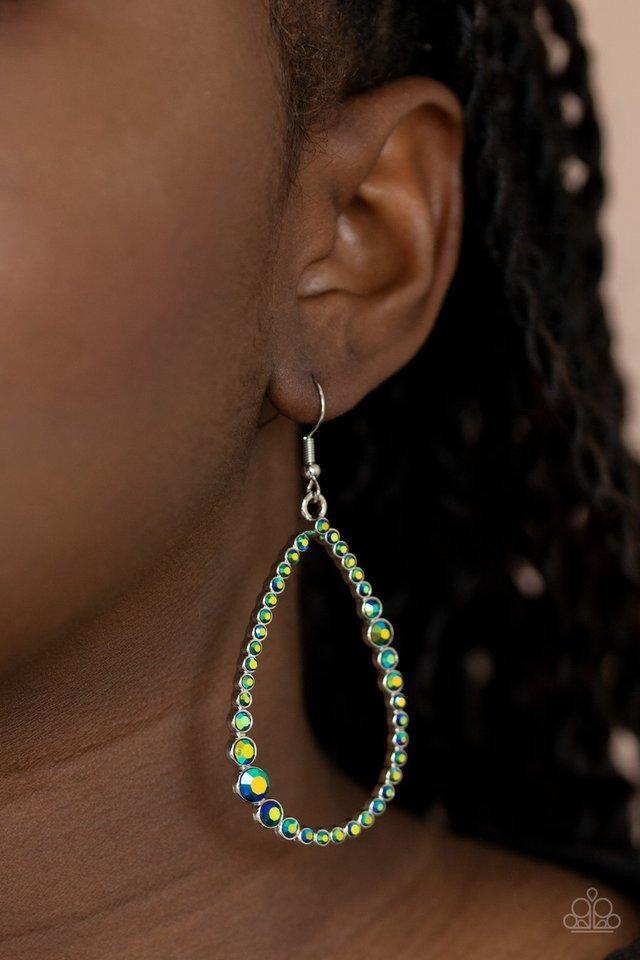 Paparazzi Accessories Diva Dimension - Green Featuring an iridescent shimmer, a variety of glittery green rhinestones coalesce into a sparkly teardrop. Earring attaches to a standard fishhook fitting. Sold as one pair of earrings. Jewelry
