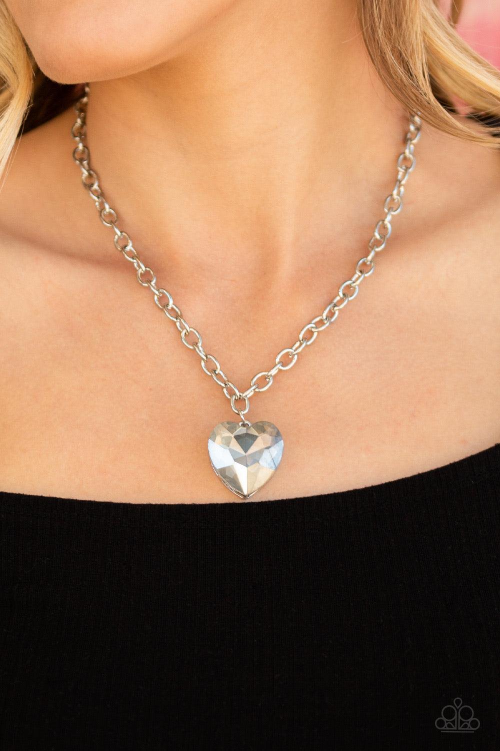 Paparazzi Accessories Flirtatiously Flashy - Silver Set atop a sleek silver fitting, a smoky heart-shaped gem swings from the bottom of a classic silver chain below the collar for a whimsical look. Features an adjustable clasp closure. Jewelry
