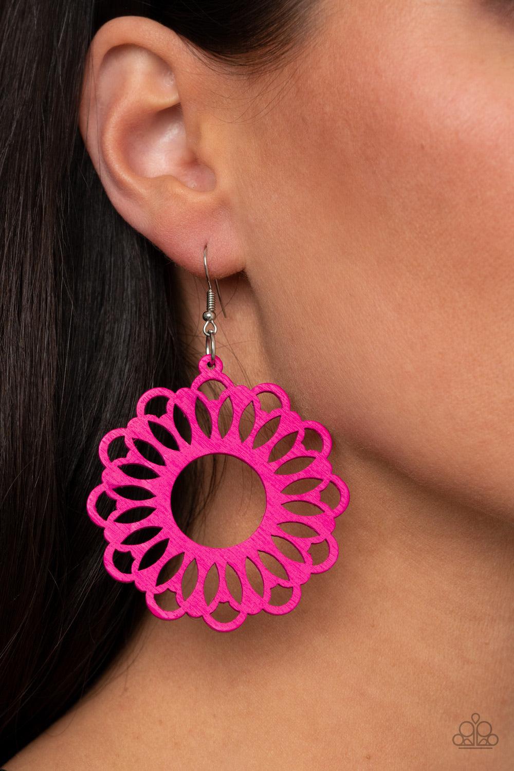 Paparazzi Accessories Dominican Daisy - Pink Painted in a flamboyant Pink Peacock finish, an airy wooden frame is cut into a whimsical stenciled pattern for a colorful floral look. Earring attaches to a standard fishhook fitting. Sold as one pair of earri