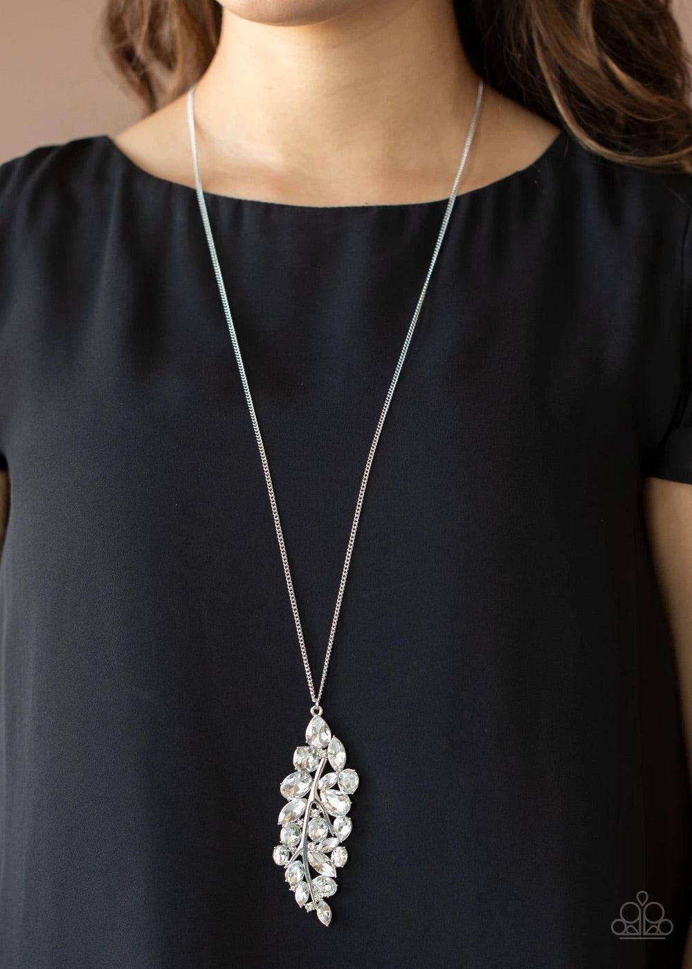 Paparazzi Accessories Take a Final BOUGH - White Featuring round, oval, square, teardrop, and marquise style cuts, a glittery collection of white rhinestones fan out from a shiny silver bar, creating a sparkly leaf pendant at the bottom of a lengthened si