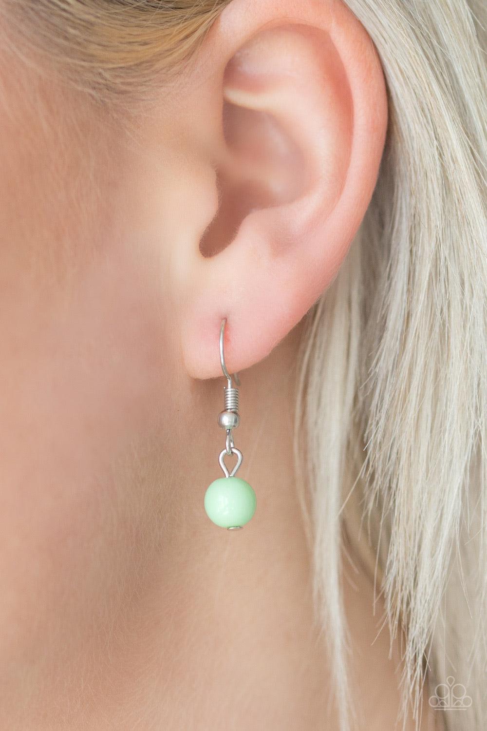 Paparazzi Accessories Gone Sailing - Green Featuring polished and cloudy finishes, refreshing Spearmint beads drip from the bottom of two shimmery silver chains below the collar. Faceted silver beads trickle between the colorful accents, adding a splash o