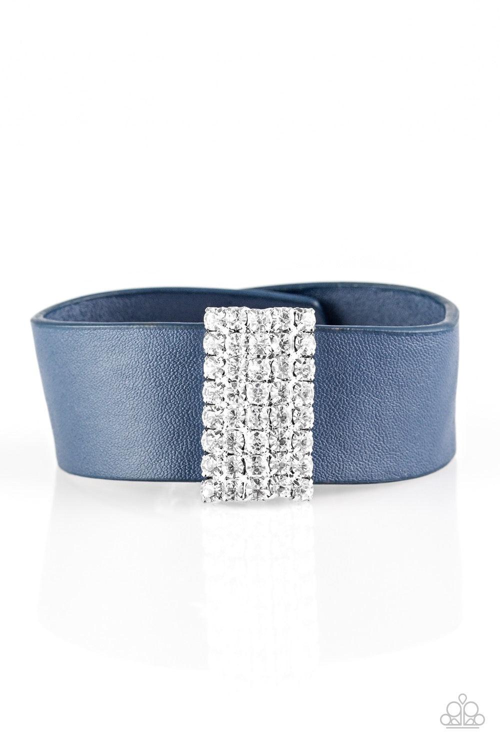 Paparazzi Accessories Walk The Catwalk - Blue Encrusted in glittery white rhinestones, a sparkling frame slides along a strip of blue leather, creating a blinding centerpiece. Features an adjustable snap closure. Jewelry